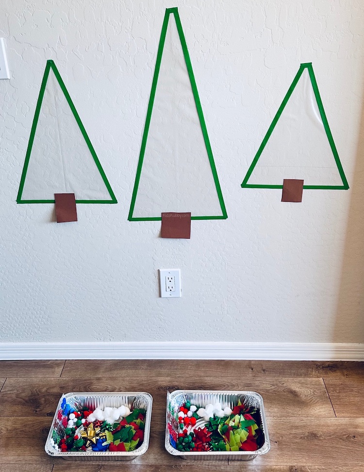 How to make an easy and fast Christmas Tree craft for toddlers using sticky contact paper, tape, and tissue paper. 