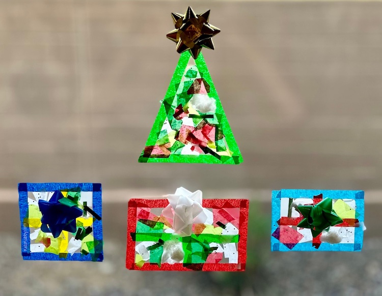 Christmas tree suncatchers are the perfect craft for toddlers. This contact paper Christmas craft is easy and fun and teaches your kids how to use their imaginations. 