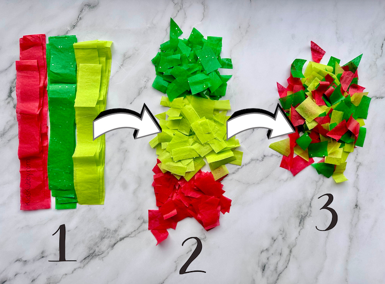 The best tissue paper Christmas tree craft for toddlers. This cheap and easy craft is perfect for little hand and can also make a great holiday gift. What a great classroom gift idea for teachers. 