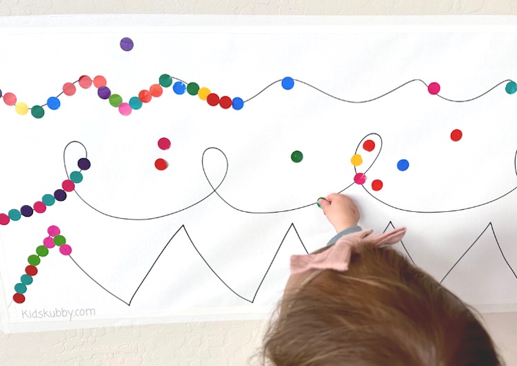 Looking for a fun indoor activity for your toddler – sticker line-ups are a great fine motor skills activity to strengthen hands and coordination. This fun and simple to set up activity is mess free fun for kids and is perfect for toddlers and preschoolers. 