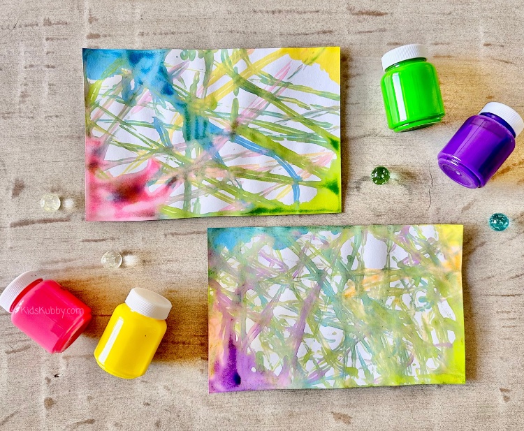 DIY marble painting is a fun and simple activity for toddlers. Looking for a mess free way for your toddlers to paint indoors – this marble craft is perfect. All you need is a tray, paper, a few marbles and your favorite washable paint and you’ll be able to set up a simple and engaging craft for your kids in minutes. My kids loved using different colors and number of marbles to create variations in their paintings. Try this today!