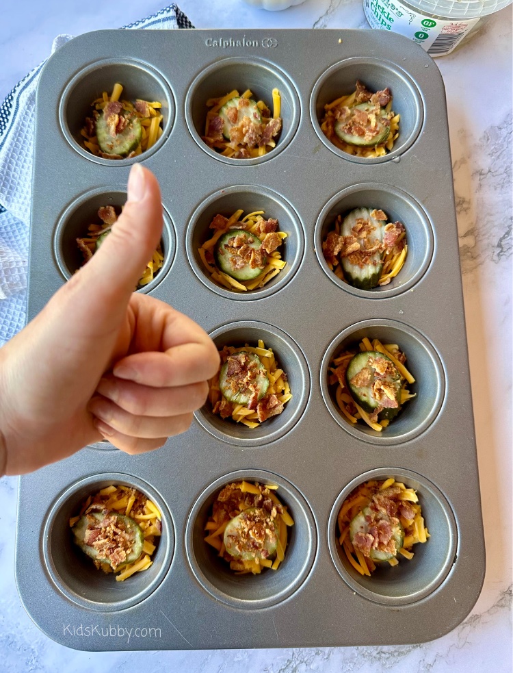You have to try this easy appetizer recipe to make with your kids. I love to involve my kids in the kitchen and what’s better than finding easy recipes that are simple for kids to make. Cheesy Bacon Fried Pickles made with 3 ingredients are not only quick to make but they are so delicious. Have you kids help you spread the cheese, pick the perfect pickles, and sprinkle the bacon bits. And the best part of every recipe is the taste test right! Your kids will love making fried pickle popper with you! Make this easy appetizer recipe today! 