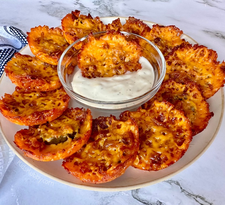 Are you looking for a fried pickle recipe that’s gluten free? This Cheesy Bacon Fried Pickle Popper recipe is perfect for your next party. With only 3 ingredients, you can make a delicious gluten free appetizer recipe that is sure to please everyone. Once cooled, dip these yummy fried pickles in creamy ranch for the perfect snack. Try this easy appetizer recipe today! 