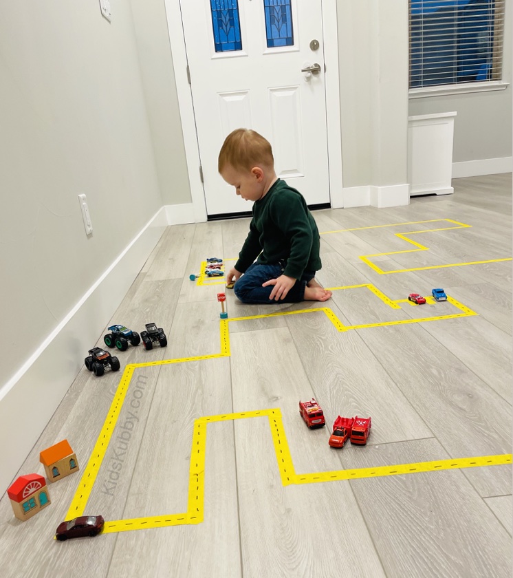 Fun and easy activities to do with tape! Your toddlers and preschoolers are going to love having little roads for their cars, trucks, and tractors to drive on. So cheap and simple! Just use tape to make a fun course for them to drive on. 