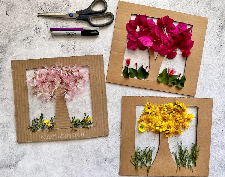 DIY Flower Trees are a fun and interactive craft for kids using supplies you already have around your house! If you're like me, you always have a few amazon boxes laying around the house. Instead of throwing these boxes into the recycling bin, turn them into beautiful nature crafts for your kids! With a few simple supplies including cardboard, packing tape, and flowers you can create a fun and interactive outdoor activity that your kids are sure to love. 
