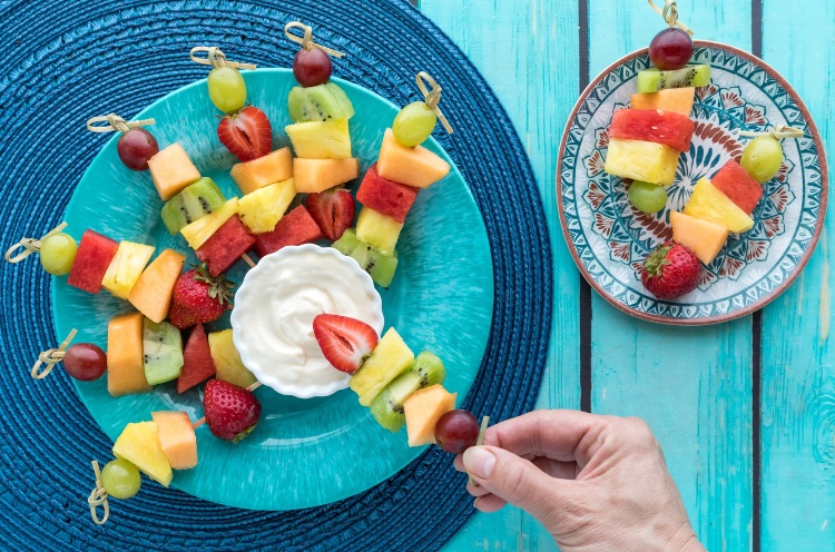 How many times do your kids come home every week and want a snack? The easiest thing to do is give them some processed food from the pantry. But what if there is a better snack that can be made in 5 minutes? Fruit Skewers are fun, delicious, and full of vitamins for growing kids. Pair this fun snack with the best cream cheese fruit dip and you’re sure that have a hit snack on your hands. Make the dip ahead of time to make snack time a breeze!