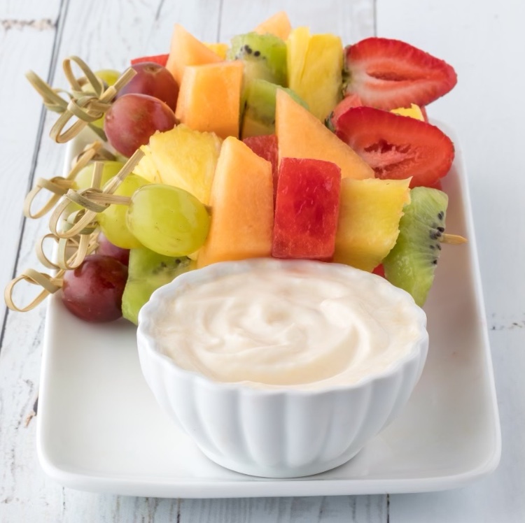 Are you looking for a healthy snack for kids? Fruit is always a great choice but that can seem a little boring sometimes. Try making fruit more exciting with Fruit Skewers and a yummy Cream Cheese Fruit Dip. This fun snack can be made in just a couple of minutes and your kids can help! My kids love picking out their favorite fruit to make fruit skewers. Older kids can even help make the cream cheese dip. Such a fun and interactive snack time with your kids!