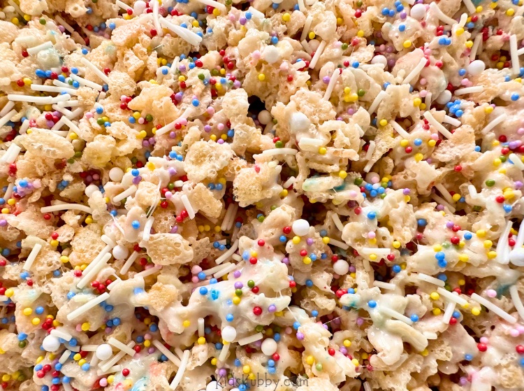 These delicious Cake Batter Rice Krispie Treats are packed with colorful sprinkles making them perfect for a kid's birthday or party treat! You'll love this fun and easy recipe made with butter, marshmallows and a few other simple ingredients.