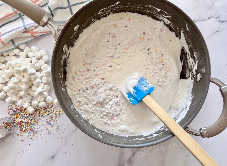 A quick and easy dessert recipe that will surely impress! These cake batter rice krispies are seriously the best dessert! One of the best reviewed recipes on Pinterest, and they are made with just a few basic ingredients: crispy rice cereal, butter, marshmallows, dry cake mix, and rainbow sprinkles for a dash of fun! A delicious homemade dessert does not always mean spending hours in the kitchen baking! If you're a marshmallow lover, you are going to go crazy for these rice krispie treats swirled with cake mix and rainbow sprinkles!