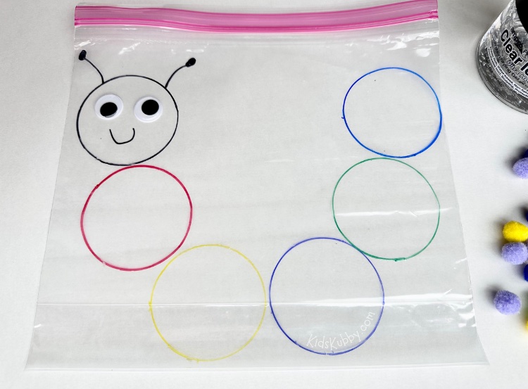 Here is the best sensory bag for preschool ever! This caterpillar color sorting sensory bag promotes color recognition and fine motor skill. And its super fun for preschoolers. This caterpillar activity would be perfect for the classroom because it cheap to make and mess free fun for kids. Using a few cheap materials including clear hair gel, a Ziplock bag, markers, and color pom-poms you can make this simple and fun color sorting activity for kids. 