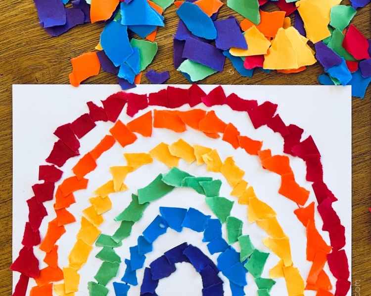 Are you looking for a fun rainy day activity? Bring the outdoors inside with this easy and cheap rainbow craft for kids. With just a few basic supplies including construction paper, glue and markers, your kids can make the prettiest torn paper rainbow craft ever! This boredom busting activity is simple to set up but will keep kids entertained as they fill in the colors of the rainbow. Make this a learning activity for preschoolers by asking what colors they are using for each line of their rainbows. What a great way for kids to learn their colors!