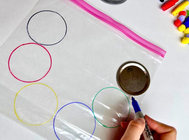 Simple to make sensory toy for kids. This caterpillar sensory bag is perfect for color matching and fine motor skill practice. Plus, it’s easy to make with cheap supplies. Try taping this sensory bag on your table or window and just let your kids go at it! Your preschoolers will have a blast sorting colors and squishing pom-poms. This is a great fine motor skills activity for toddlers too.