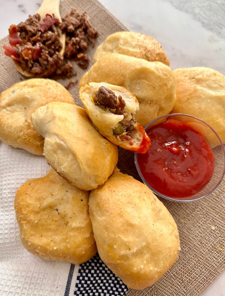 Cheeseburger biscuit bombs are a fun twist on traditional burgers. Kids especially love this dinner recipe because biscuits are an easy handheld food, plus they're fun to dip. This recipe is a great option for busy weeknights because it’s fast, simple, and so delicious. You're definitely going to want to put Cheeseburger Biscuit bombs into your weekly dinner recipe rotation!