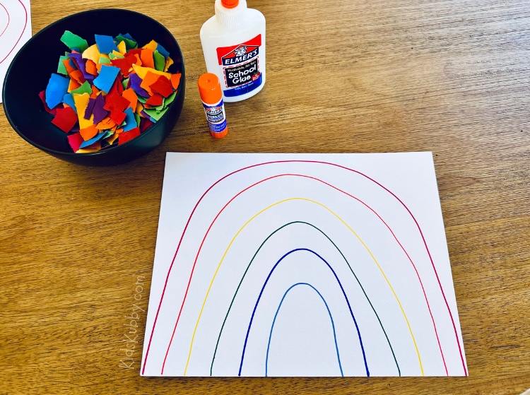 Looking for a last minute craft idea? Try construction paper rainbows with supplies you probably already have lying around. This rainbow craft is simple to set up and really fun for kids. Teach the colors of the rainbow while making a pretty art project. Your kids will have so much fun with this rainbow art project!