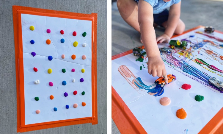 Kids painting with cars is a playful way for your children to have fun creating art while also playing with their cars. You can do this activity inside with taping the poster board to a table inside or even better if the weather is nice so you can move it outside. Your kids are going to love this activity!