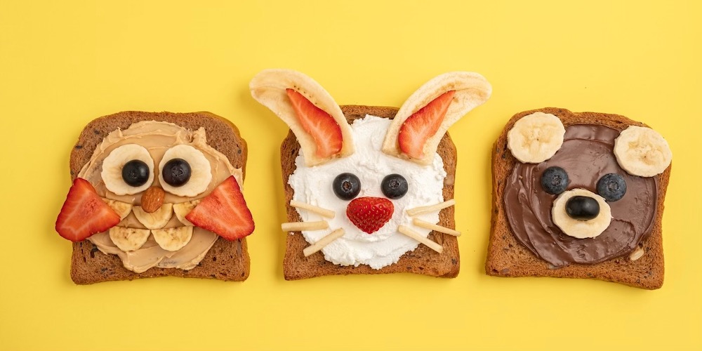 Are you looking for an easy way to bring excitement back to breakfast time? Try making your kid's favorite animals on a piece of toast. I know it sounds complicated but this healthy breakfast recipe is actually really simple. All you need is a spread like peanut butter, Nutella, or cream cheese and some sliced fruit. That's it! There are so many fun combinations of animal faces you can make for a healthy and cheap breakfast for kids.