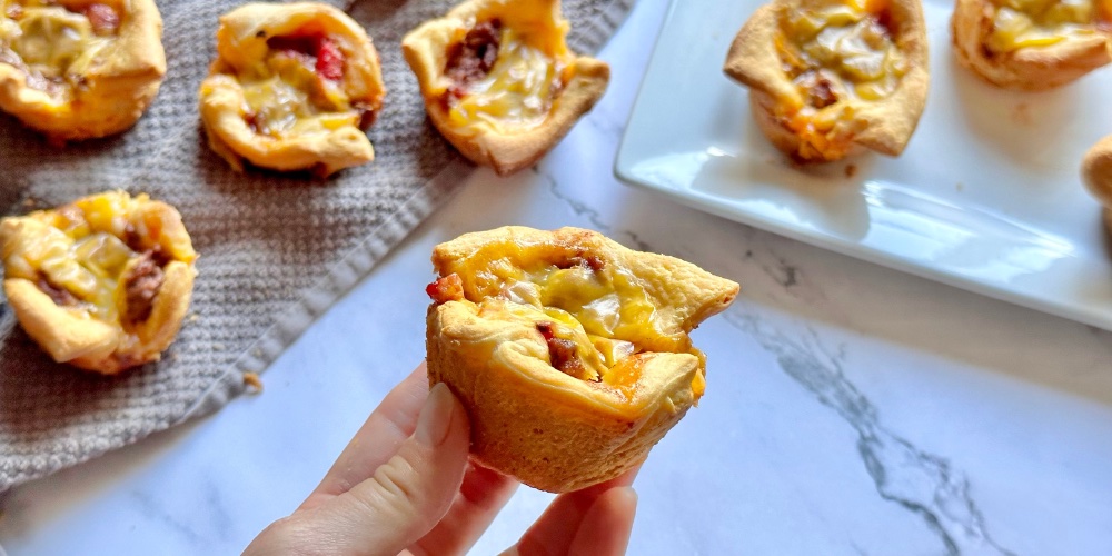 This recipe is especially popular with kids, who let’s face it can be hard to feed sometimes. If you have picky eaters at home, you've got to try this sloppy joe muffin tin recipe! Just 5 cheap ingredients required: Pillsbury crescent dough sheet, ground beef, melted cheese, bell peppers, and sloppy joe sauce. So yummy! These are also fun as a party snack or for sleepovers. Anytime your kids have friends over! The best finger food.