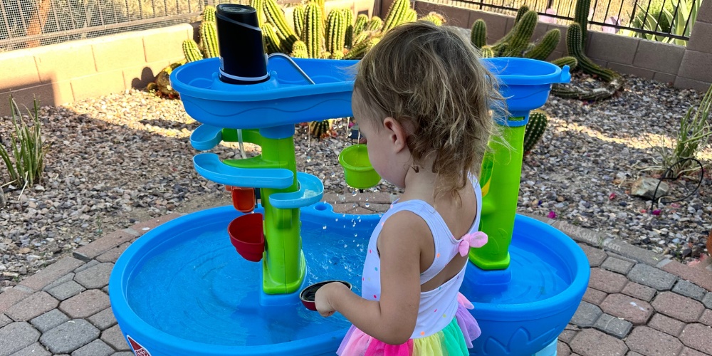 What time is it? SUMMERTIME! It’s our vacation and we don’t want to spend that vacation constantly pouring water into the top of our kids’ water table. I love a good water table, but it seems like one of my kids is always complaining that they can’t keep the water flowing out of the top portion. Well, here is the solution. The best water table hack ever! With a cheap pump from amazon and 5 minutes you can create a fountain oasis that will keep your kids happily playing for hours!