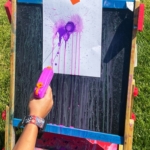 Painting with water guns is an exciting action-packed art project your children will love! Great for all ages!