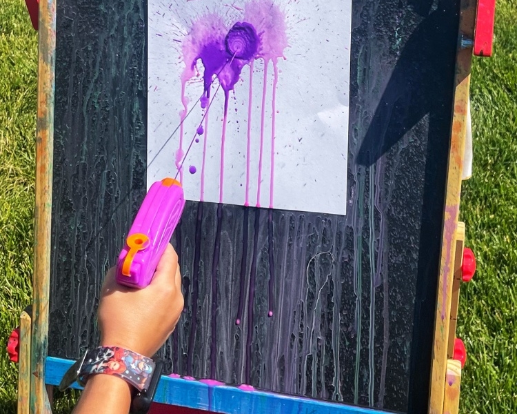 Painting with water guns is an exciting action-packed art project your children will love! Great for all ages!