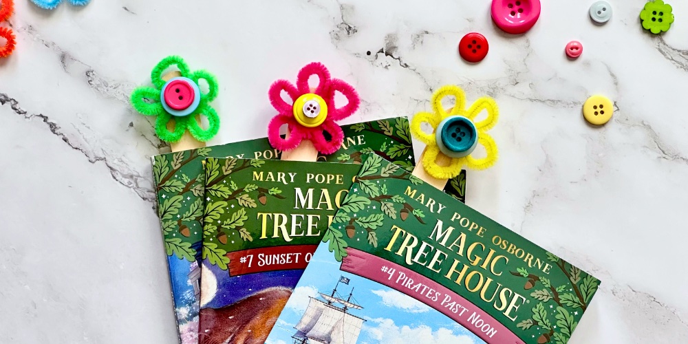 These adorable flower bookmarks are SO easy to make with cheap supplies you can find at the dollar store. Heck, you probably already have these supplies at home! With just pipe cleaners, jumbo popsicle sticks, and buttons your kids can create cute flower bookmarks. I mean can you think of a better incentive to encourage reading this summer? Plus, this simple craft is a great way to keep little hands busy when they get bored!