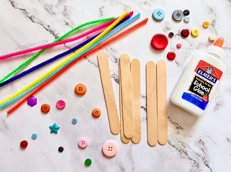 DIY flower bookmarks are so fun to make with just a few simple supplies you probably already have at home. If not, a quick trip to the dollar store for popsicle sticks, pipe cleaners, and buttons will get you ready to make the best homemade bookmarks ever. My kids absolutely loved making these pipe cleaner bookmarks because they could customize each one with their favorite colors! Talk about a great way to get your kids excited about reading!