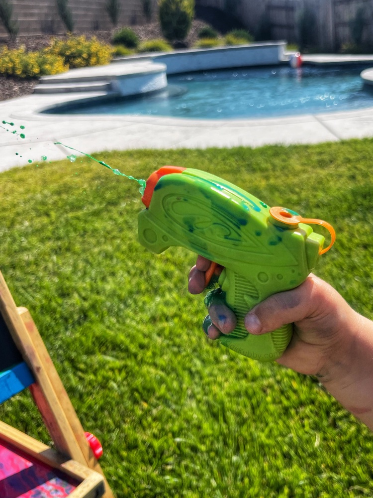 Are you looking for a fun and easy color art activity? Water gun painting is cheap and easy filled with action packed fun. Your kids will sure to to love!