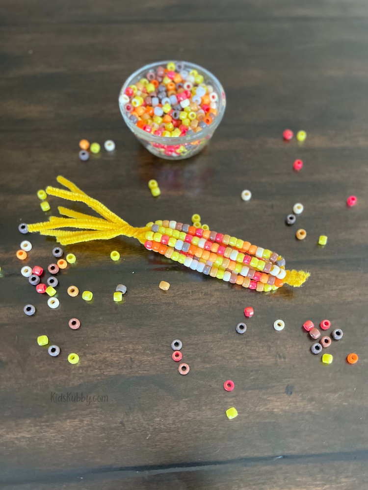 Let the fall festivities begin with beaded corn craft using just two supplies pipe cleaners and pony beads! Perfect for a cheap and easy crafts for kids at home or in school.