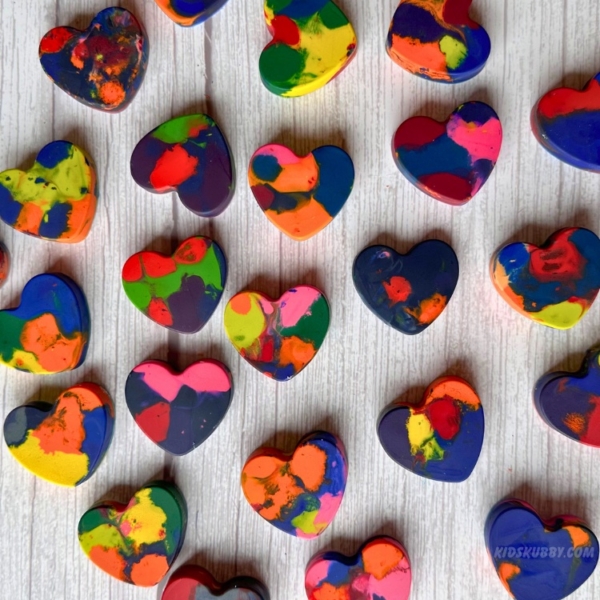 Check out this simple way to recycle crayons into fun heart shapes. These melted crayon hearts are the perfect valentine's day craft. Free printable valentines day cards including.