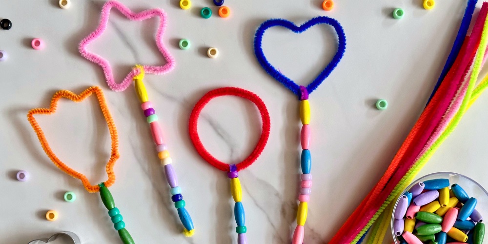 DIY bubble wands are a simple to make outdoor craft for kids that everyone is sure to love. All you need is a couple of cheap supplies from the dollar store and your kids can make their very own customized bubble wand. This easy pipe cleaner craft is perfect for parties too!