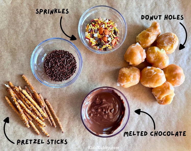 how to make the best acorn donut holes with 4 simple ingredients including fall sprinkles, melted chocolate, pretzel sticks, and donut holes of course.