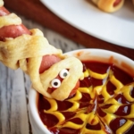 Have you tried making mummy dogs for your kids? This Halloween is the perfect time to make this spooky recipe. Plus kids love to help wrap each hot dog in butter, flakey crescent rolls. Try adding some cheese or jalapeños for an adult version of this tasty halloween recipe.