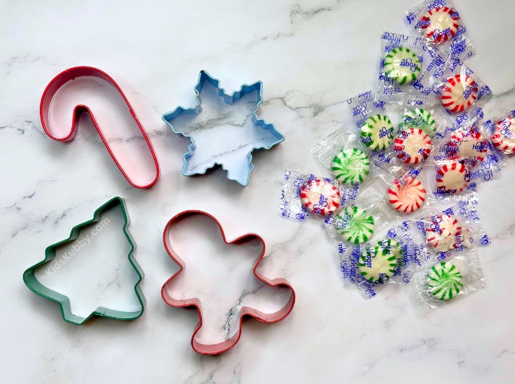 Are you looking for a fun Christmas craft to make with your kids? Melted peppermint candy ornaments are so fun to make with just cookie cutters and peppermint candies. Make these fun DIY ornaments every year as an inexpensive Christmas activity. 