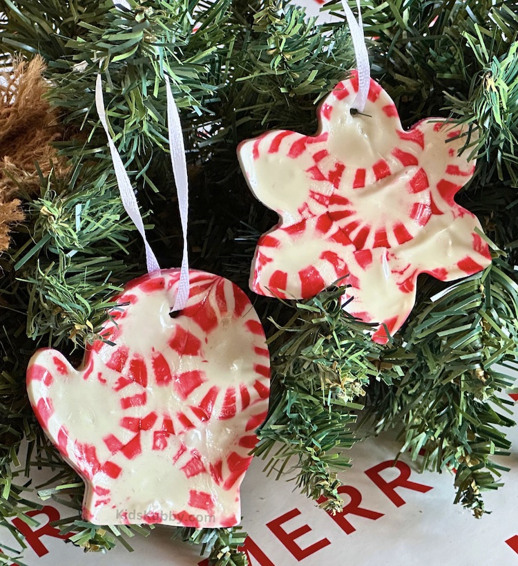 unique Christmas activity for kids of all ages. melting peppermint candies in the oven using cookie cutters is the easiest way to make the best homemade ornaments ever! 