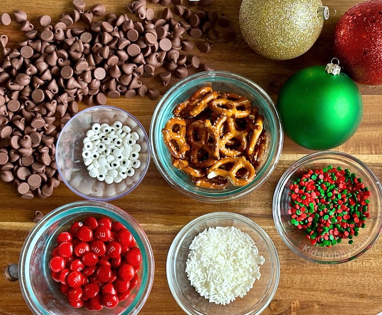 All you need to make the best reindeer bark ever is chocolate chips, pretzels, candy eyes, red m&ms and some sprinkles. In 5 minutes or less you can create adorable reindeer bark this holiday season. Try using different chocolates to make this Christmas candy recipe extra special. 