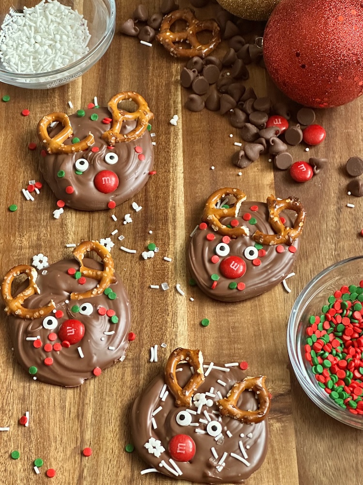 The best reindeer bark recipe ever! Im serious this recipe is so easy to make that even my kids can do it on their own. Just melt some chocolate in the microwave, add some decorations and chill until the chocolate hardens. ITs that easy. Make sure to share this easy christmas candy with all your friends and family this holiday season.