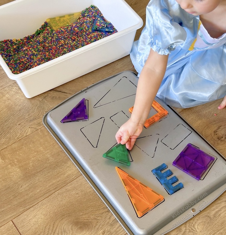 If you're looking for a fun toddler activity that also teaches shapes, this is the one for you! magnetic shapes sensory bins are fun and engaging while helping little ones with shape recognition. Plus all the supplies are from the dollar store!