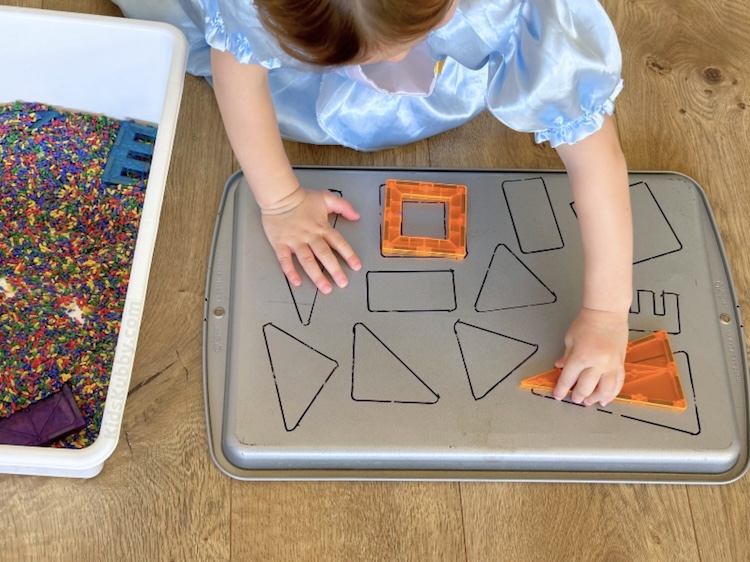 Have you tried this shapes sensory bin yet? Easy to make and do much fun for kids, this magnetic shapes game is the best way to teach toddlers shape recognition. Plus you probably already have all the supplies at home!