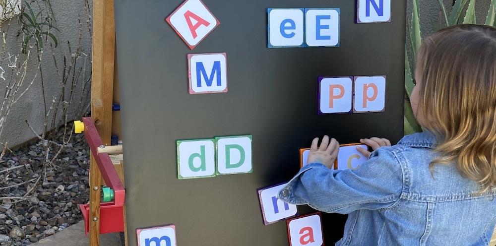 ABC match is the perfect way to practice the alphabet with toddlers and preschoolers. This easy homemade matching game with free printouts is easy to make and fun for kids to play. Simply tape different letters to magnetic tiles and let your kids match upper and lower case letters!