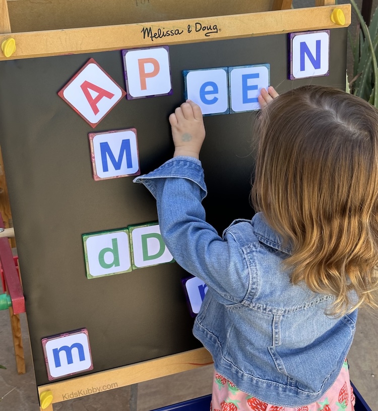 learning through play is alway so much fun for kids. This easy alphabet game teaches toddler upper and lower case letters using magnetic tiles. Such and easy, fun, and cheap activity for kids