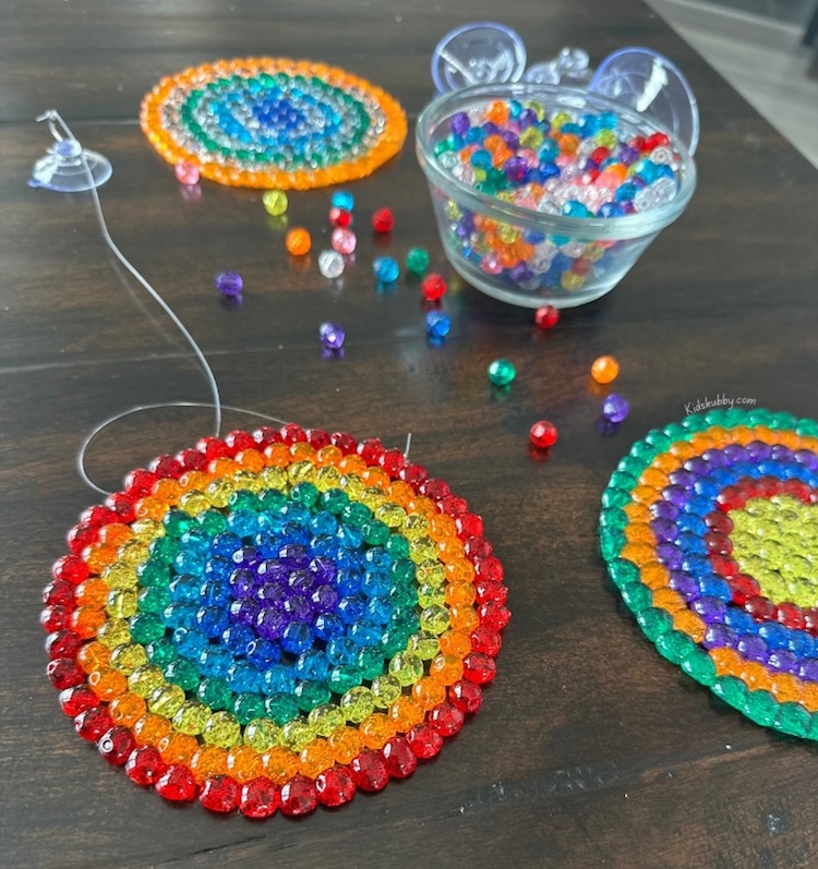 How to make beautiful suncatchers at home with beads in the oven. A simple and fun craft idea to do with kids when bored at home. 