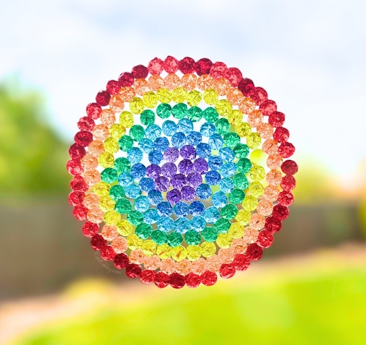 Beautiful and fun project to make at home with the kids! These melted bead suncatchers look awesome displayed in a window, making for a magical and bright space. 