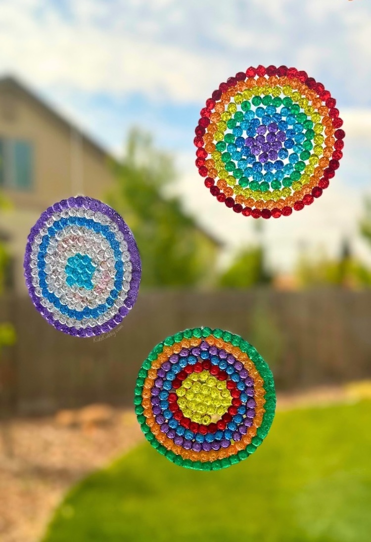 How to make DIY suncatchers with beads. If you're looking for fun projects to do at home with your kids, these suncatchers look beautiful and cheery displayed in any window.