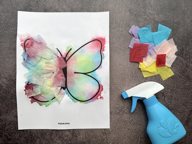 How pretty is this paper butterfly painted with tissue paper? Using bleeding tissue paper and a spray bottle, kids can paint with tissue paper. What a fun craft for spring and summer!