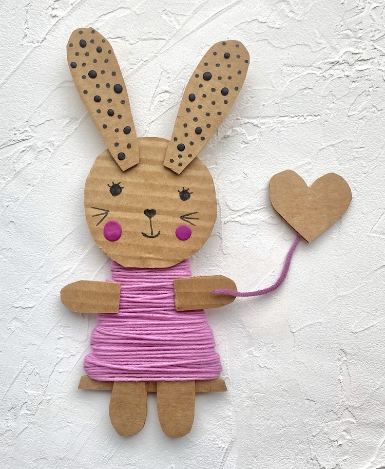 Cute craft idea for kids! Try making these adorable bunnies out of cheap recycled materials including cardboard, yarn, and markers. Super fun for children of all ages. They are fun to play with as well as decorate your home during spring or Easter.