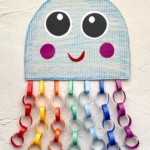 Easy colorful jellyfish craft idea for kids made with constructions paper and recycled cardboard. A fun project to do at home when bored! This ocean themed craft is fun for children of all ages.