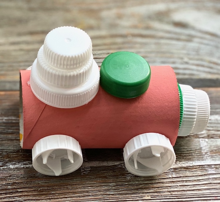Colorful toy trains made with recycled paper rolls! An easy homemade craft for kids of all ages. My preschoolers had a blast making these with me. 
