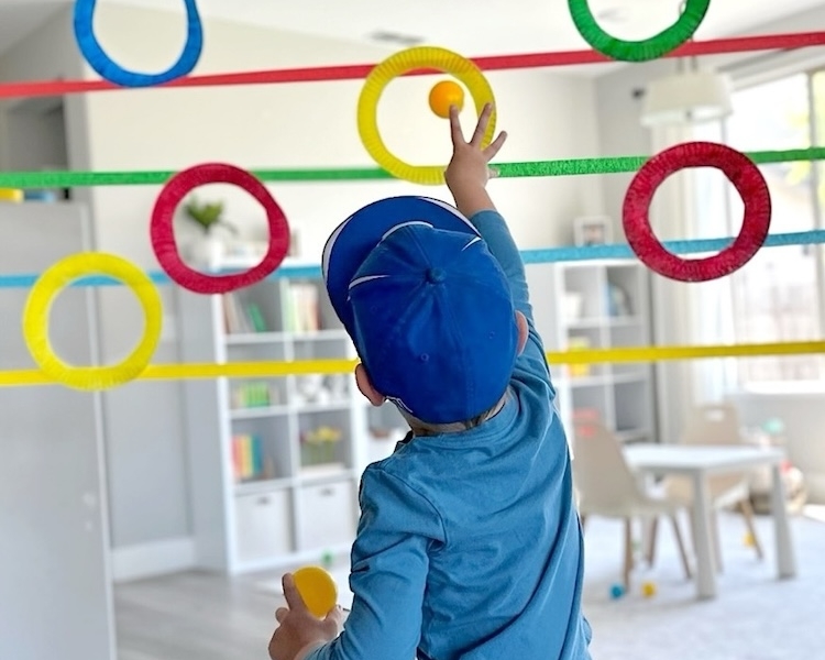 DIY Ball Toss Target Practice Game For Kids | Stuck at home on a rainy day with bored kids to entertain? You've probably already got the supplies needed to make this cheap and easy project! Paper plates, masking tape, and paint.
