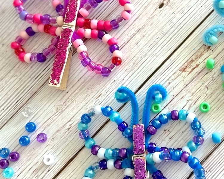 DIY Craft Tutorial For Kids | How to make charming little butterflies out of just a few common craft supplies! Pony beads, pipe cleaners, and clothespins.