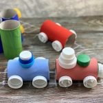 Fun toilet paper roll craft for kids made with cheap recycled materials from home including plastic bottle caps! Step by step tutorial on how to make a cardboard train set.